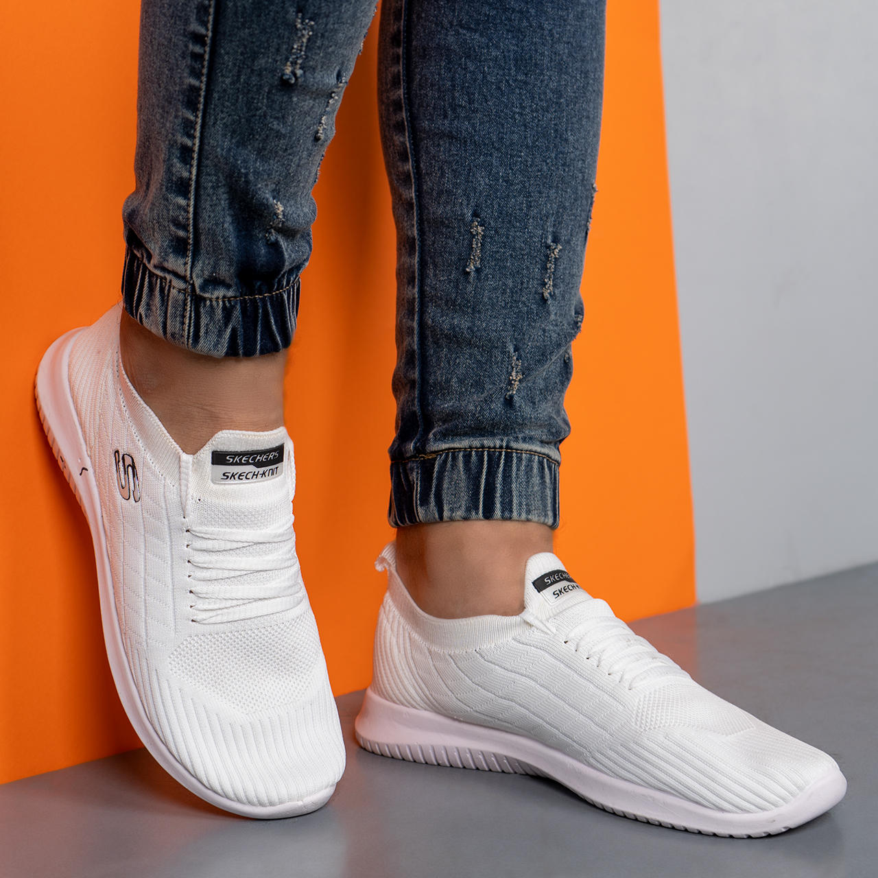 کفش ورزشی اسکیچرز مردانه سفید مدلE55